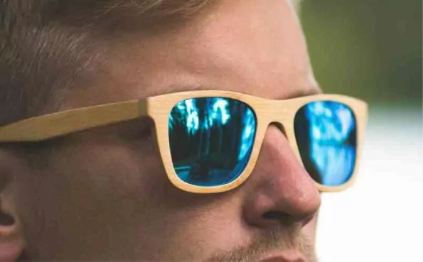 A Boy is Wearing a Blue Shade Mirrored Glasses