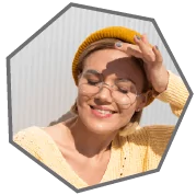 Girl is smiling and Wearing a Glasses